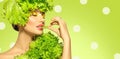 Healthy eating, diet. Beautiful healthy girl eating raw vegan food and smiling. Beauty young fashion woman eats green fresh lettuc Royalty Free Stock Photo