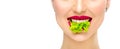 Beautiful healthy girl eating raw vegan food and smiling. Lips. Beauty young fashion woman eats green fresh lettuce salad leaf Royalty Free Stock Photo