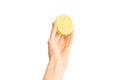 Healthy eating and diet Topic: Human hand holding half of lemon isolated on a white background in the studio, first-person view Royalty Free Stock Photo