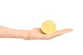 Healthy eating and diet Topic: Human hand holding half of lemon isolated on a white background in the studio Royalty Free Stock Photo