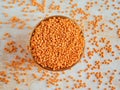 Healthy eating and dietary. Bowl of raw red lentil on white wooden background. Top view. Flat lay. Masoor Dal or Royalty Free Stock Photo