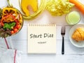 Healthy eating, dieting, slimming and weight loss goals concept. target of diet plan on paper with salad bowl, fresh vegetable Royalty Free Stock Photo