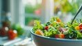 Healthy eating, dieting, vegetarian kitchen, and cooking concept - close-up of vegetable salad bowl and fork at home