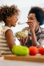 Healthy eating family and people concept. Happy mother and daughter having breakfast at home kitchen Royalty Free Stock Photo