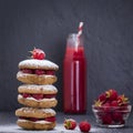 Oat cookies with raspberry, soft cheese, honey and raw raspberry and red juice on the background of black slate , close up Royalty Free Stock Photo