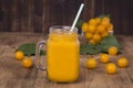 Yellow plum juice in a glass and ripe yellow plum on a vintage wooden table. Bio healthy food and drink. Organic diet. Royalty Free Stock Photo
