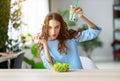 Healthy eating. happy young girl eating salad in morning in kitchen Royalty Free Stock Photo