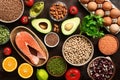 Healthy eating ingredients: fruits, vegetables, legumes, fish, eggs, seeds. The concept of a balanced diet food. Top view, flat