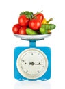 Healthy eating. Kitchen scale with vegetables isolated Royalty Free Stock Photo