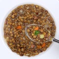 Healthy eating lentil soup stew with lentils on spoon from above Royalty Free Stock Photo