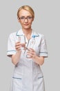 Healthy eating or lifestyle concept - female woman doctor holding and a glass of clear fresh water Royalty Free Stock Photo