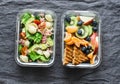 Healthy eating lifestyle concept. Office sweet, savory food lunch box. Pasta, tuna, spinach, avocado salad and fruit, peanut