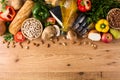 Healthy eating. Mediterranean diet. Fruit,vegetables, grain, nuts olive oil and fish on wood Royalty Free Stock Photo