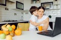 Healthy Eating. mom with baby eating fruits in the kitchen Royalty Free Stock Photo