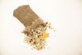 Healthy eating oat flakes in a linen sack, closeup on a white background Royalty Free Stock Photo