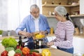 Healthy Eating For Seniors. Portrait Of Elderly Spouses Cooking Together In Kitchen Royalty Free Stock Photo