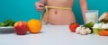 Healthy Eating. Slim waist. Woman on Diet measure waistline. Calories and diet concept. Vegetarian fresh food. Healthy Royalty Free Stock Photo