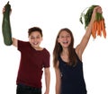 Healthy eating smiling children with carrots and zucchini vegetables Royalty Free Stock Photo