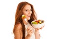 Healthy eating - woman eats a bowl of greek salad isolated over Royalty Free Stock Photo