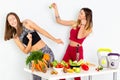 Healthy Eating Women Cooking Salad. Beautiful Smiling Vegan Girls Going To Eat Fresh Green Organic Vegetables. Royalty Free Stock Photo