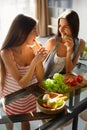 Healthy Eating Women Cooking Salad In Kitchen. Fitness Diet Food Royalty Free Stock Photo