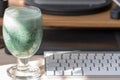 Healthy eating at work. Green protein smoothie with spirulina powder