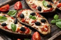 Healthy Eggplant or Aubergine pizza with tomato sauce, mozzarella cheese, basil and olives