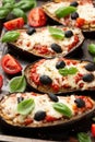 Healthy Eggplant or Aubergine pizza with tomato sauce, mozzarella cheese, basil and olives