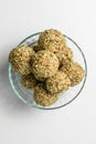 Homemade energy balls with nuts and sesame seeds on white background Royalty Free Stock Photo