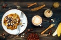 Healthy fall and winter breakfast. Vegan vanilla french toast with caramelized bananas, raw dark chocolate and hazelnut butter Royalty Free Stock Photo