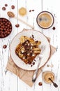 Healthy fall and winter breakfast. Vegan vanilla french toast with caramelized bananas, raw dark chocolate and hazelnut butter Royalty Free Stock Photo