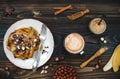 Healthy fall and winter breakfast. Vegan vanilla french toast with caramelized bananas, raw dark chocolate and hazelnut butter Royalty Free Stock Photo