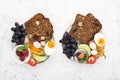 A healthy farmer family breakfast snack. Slices of cereal bread with nuts, poppy rolls, halves of boiled egg, cucumber