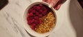 Healthy and fast breakfast oatmeal with cocoa and raspberry