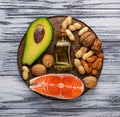 Healthy fat salmon, avocado, oil, nuts Royalty Free Stock Photo