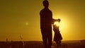 Healthy father and little daughter whirl in dance at sunset. concept of happy childhood. Dad is dancing with child in Royalty Free Stock Photo