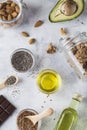 Healthy fats sources flax nuts oil avocado chia seeds bitter chocolate . Concept of healthy food Royalty Free Stock Photo