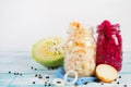 Healthy fermented vegetables in glass jars on a wooden background. Royalty Free Stock Photo