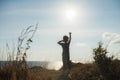 Healthy fit boy raising his hand after reaching to mountain summit Royalty Free Stock Photo