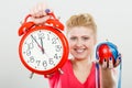 Happy woman holding clock, apple and measuring tape Royalty Free Stock Photo