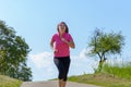 Healthy fit woman enjoying a jog in sunshine Royalty Free Stock Photo