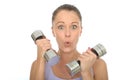 Healthy Fit Young Woman Training With Dumb Bell Weights Pulling Silly Facial Expression