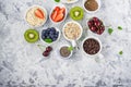 Healthy fitness food from fresh fruits, berries, greens, super food: kinoa, chia seeds, flax seed, strawberry, blueberry Royalty Free Stock Photo