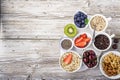 Healthy fitness food from fresh fruits, berries, greens, super food: kinoa, chia seeds, flax seed, strawberry, blueberry Royalty Free Stock Photo