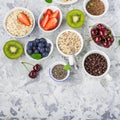 Healthy fitness food from fresh fruits, berries, greens, super food: kinoa, chia seeds, flax seed, strawberry, blueberry Royalty Free Stock Photo