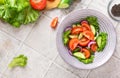 Healthy fitness fresh simple salad. Close up photo of healthy food Vegetable green salad cucumbers tomatoes onions flat lay top Royalty Free Stock Photo