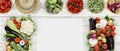 Healthy food above concept with many fresh vegetables and cutting boards on kitchen white worktop, copy space, top view