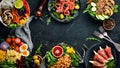 Healthy food. Assortment of the Buddha Bowl on a black background. Top view. Free space