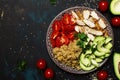 Healthy food, avocado, quinoa, chicken and tomatoes on plate, to