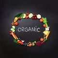 Healthy food background. Circle of fresh vegetables, fruits, nuts, berries with handwritten phrase Organic on black Royalty Free Stock Photo